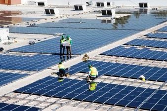 Workers Install Solar Panels on Walmart Store